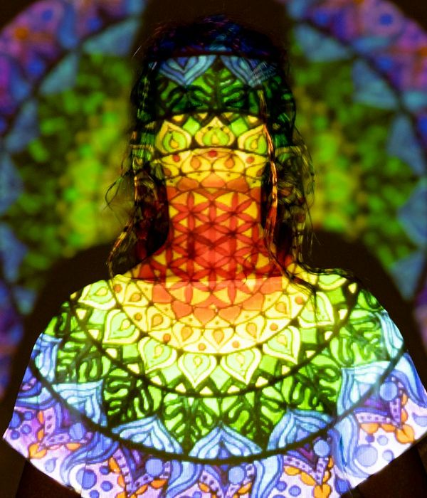 Serene woman meditating in a lotus position with a blue accent light.
